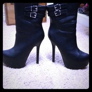 Gently loved Tezra heeled boots.